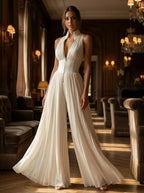 Model in ivory pleated evening jumpsuit