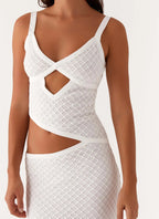 Elegant white summer maxi dress with cut-out details