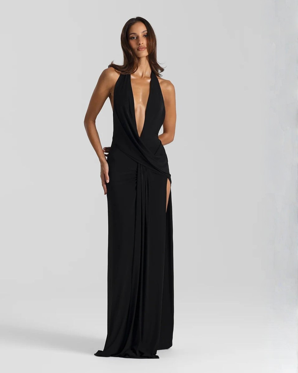 High side slit detail on the black floor-length maxi dress
