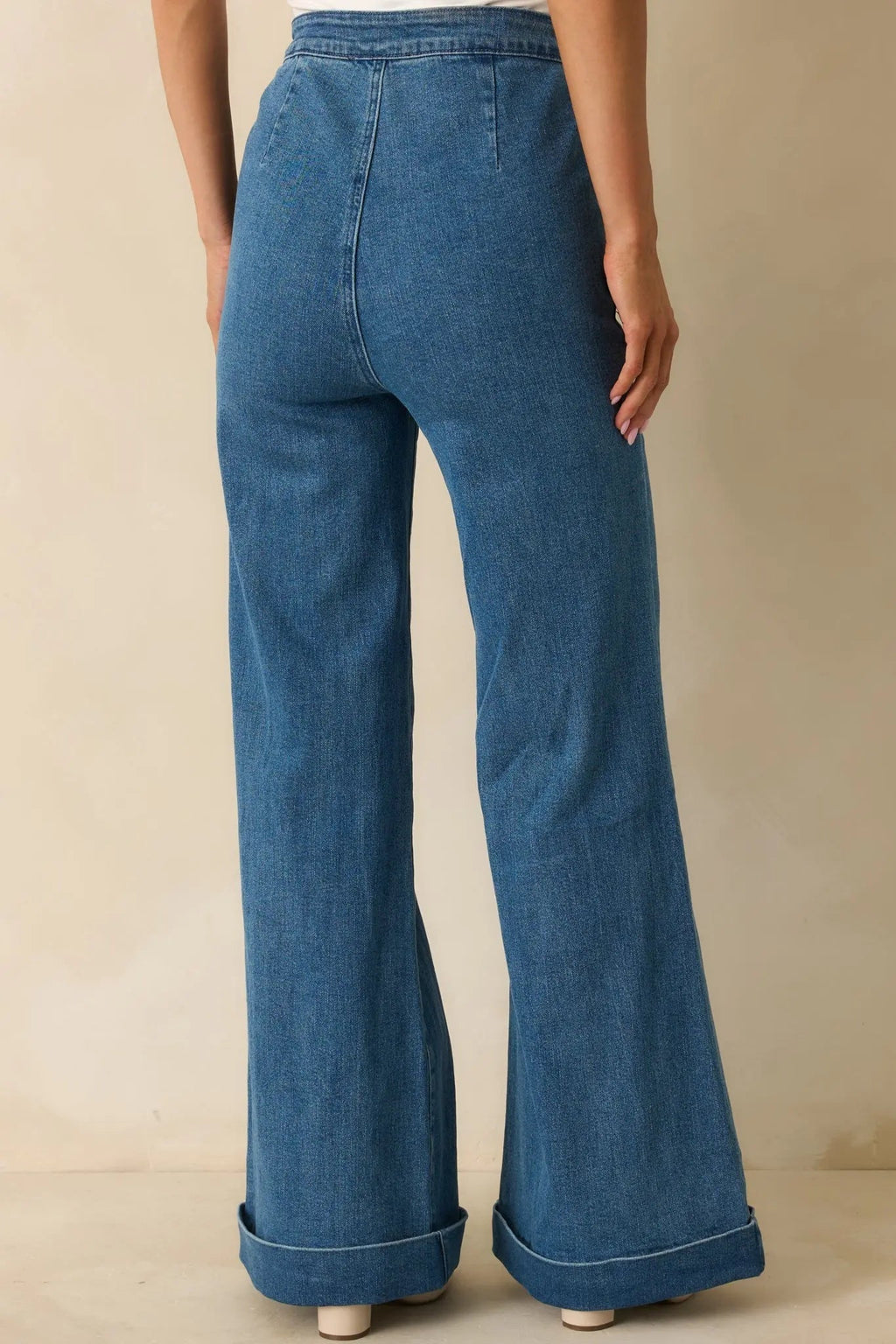 Indigo high-waisted stretch wide-leg jeans, fabric close-up