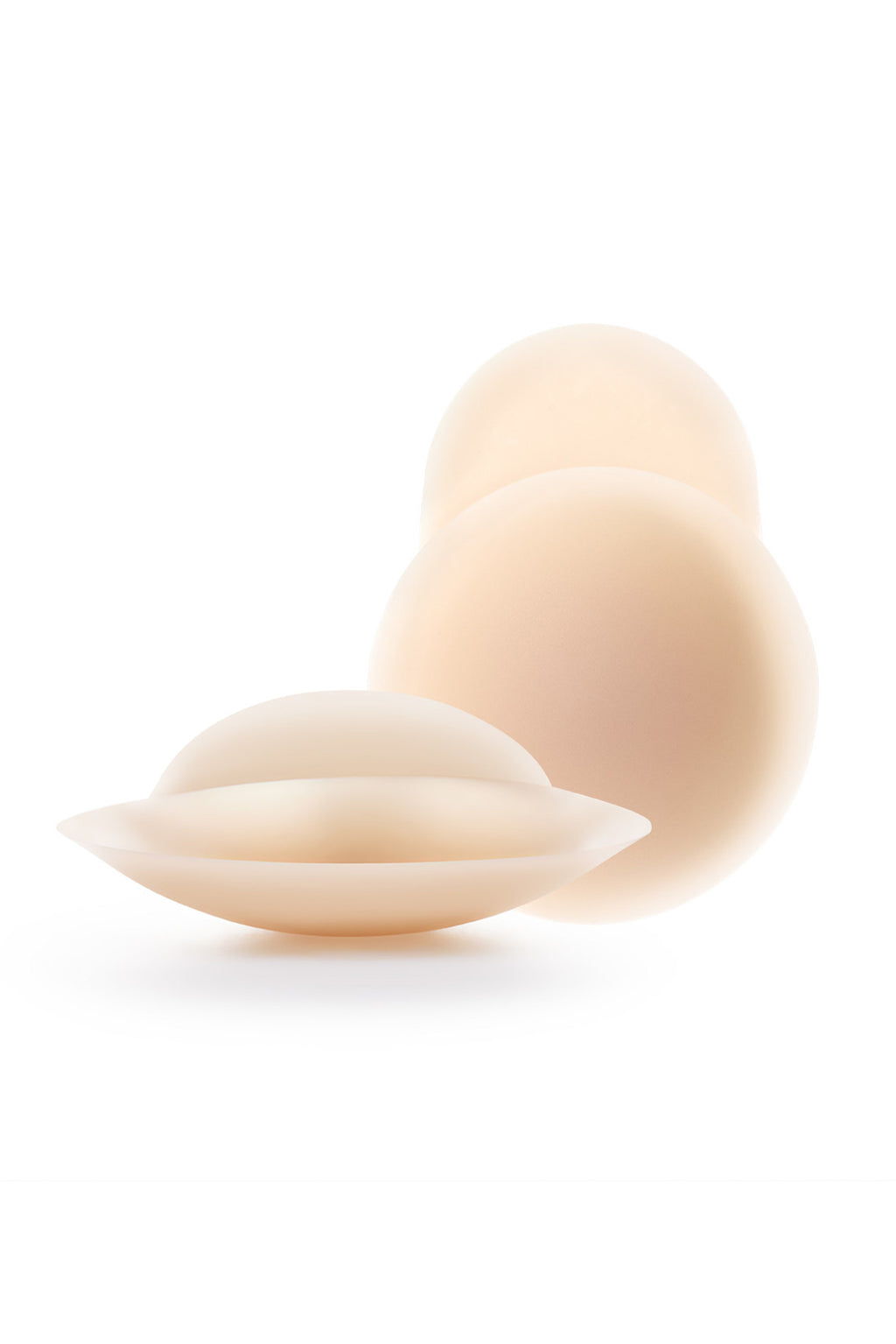 Pair of reusable silicone nipple covers showing the smooth adhesive backing
