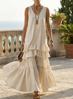 Female model wearing the sleeveless ice-silk maxi dress with fluid drape