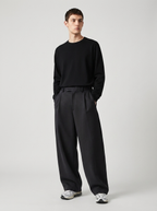 Male model wearing oversized wide-leg sweatpants, relaxed jogger fit